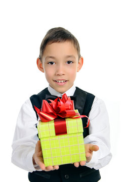 boy in black suit holding green gift box isolated