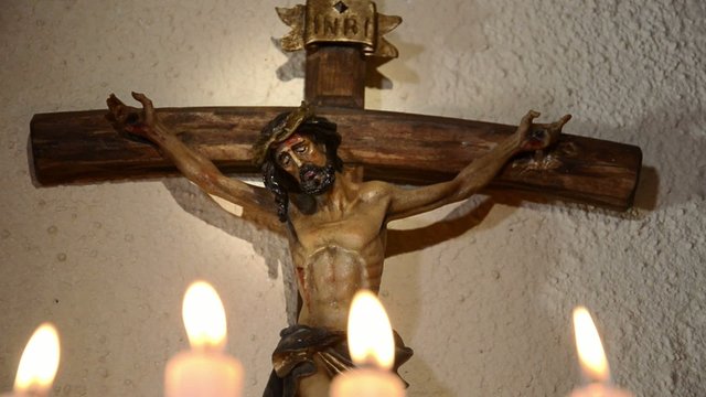 crucifix and candles