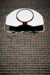Basketball Hoop on Brown Brick Wall