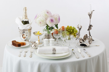 table with dishes and flowers