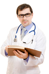 A doctor with a stethoscope is reading a book
