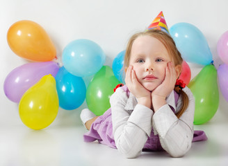 Little girl with balloons