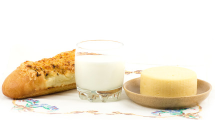 Beautiful bread with milk on white background