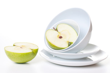Two halves of a large green apple