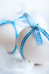 White Easter Eggs with Blue Ribbons