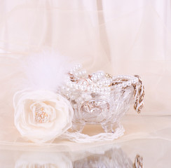 bridal rose with wedding beads in crystal vase