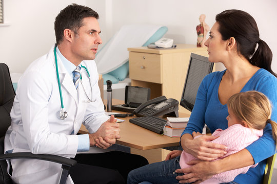 American Doctor Talking To Worried Mother