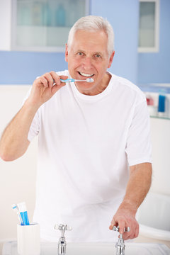 Senior Man Brushing Teeth