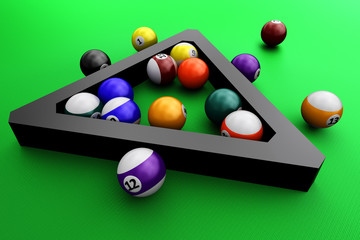 Colorful pool balls over green