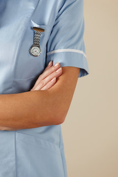 UK Nurse Standing With Arms Folded