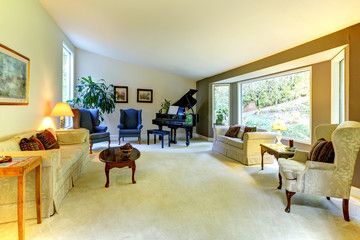 Large living room wit piano and window