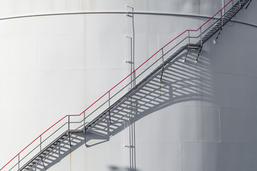 Fototapeta premium white tank in tank farm with blue sky
