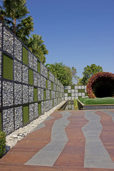 Stone wall switch grass in the park