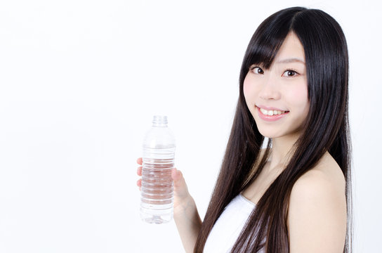 attractive asian woman with bottle of water