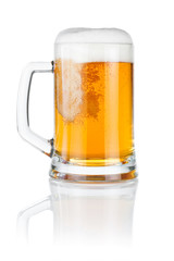 Pouring fresh beer into mug isolated over a white background
