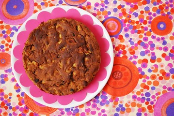 Homemade apple cake on colorful background