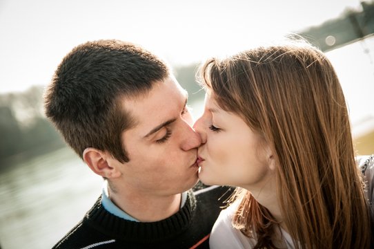 Young kissing couple in love