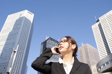 A building and a young businesswoman