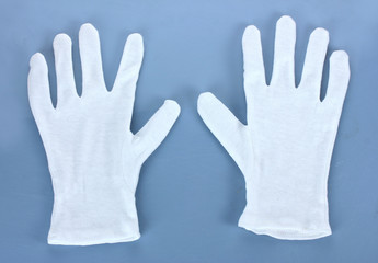 Obraz premium cloth gloves on blue background.