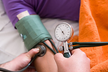 Nurse measuring blood pressure
