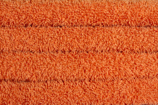 Pile of fluffy orange towels