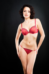 Fototapeta premium girl in red underwear on black background