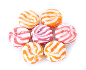 striped fruit candies isolated on white