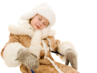 A girl in a warm sleeping clothes on a white background.