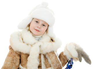 Obraz premium The girl in warm clothes smiling on white background.