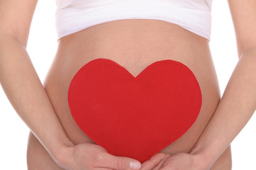 pregnant woman holding red heart