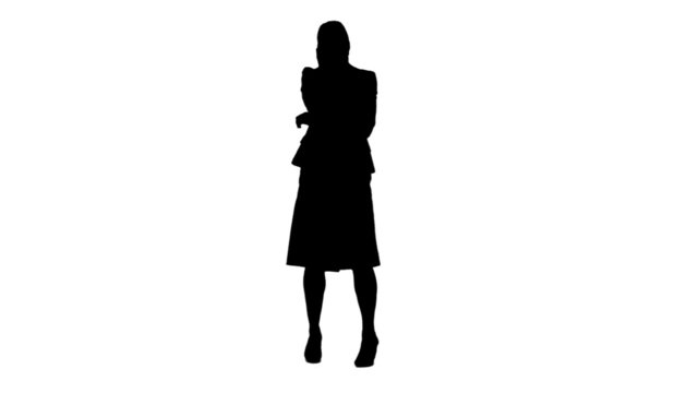 Silhouette of a woman talking on her mobile phone