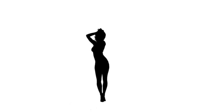 Silhouette of a dancing woman on her own