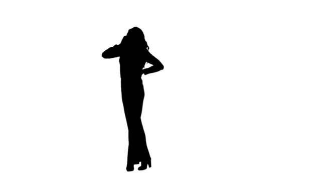 Silhouette woman talking on her mobile phone