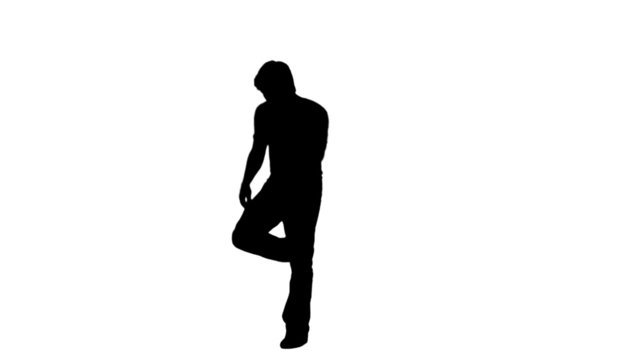 A silhouette man is dancing