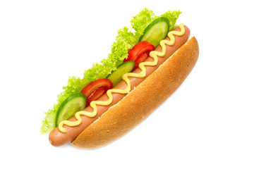 hot dog with cucumbers, tomatoes, lettuce, and mustard on white