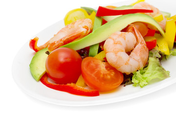 healthy salad of shrimp, mixed greens and tomatoes.