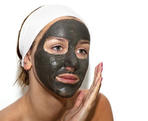 Deep sea mud mask treatment on the woman face