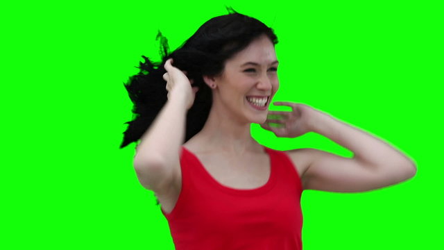 Woman swaying while flicking her hair