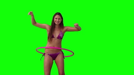 Woman playing with a hula hoop - Powered by Adobe