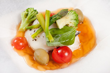 fish with vegetables in the parchment