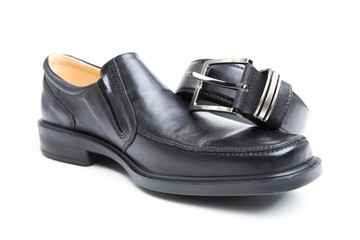 Man's boot and belt on a white background