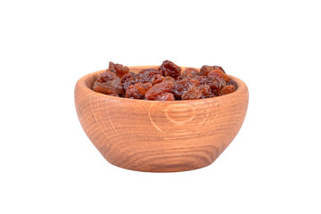 Raisin in wooden bowl, isolated on white background