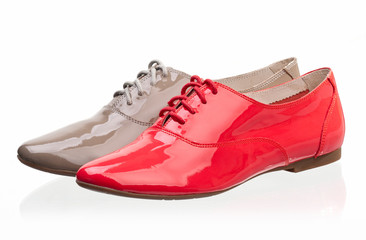 Patent leather women shoes against white