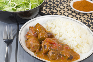 Goulash - Hungarian sausage stew served with white rice & salad