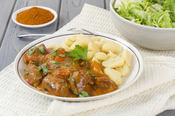 Goulash - Hungarian sausage stew with homemade nokedli & salad