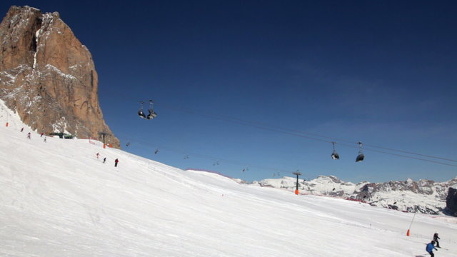 Skiers and Snowboarders going down the slope