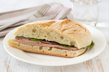 sandwich with ham and lettuce on the plate