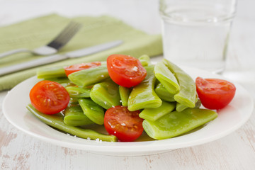 salad green beans and tomato on the plate