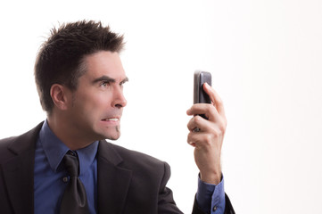 Wütendenden Geschäftsmann nervt Telefon