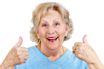 Happy senior woman thumps up